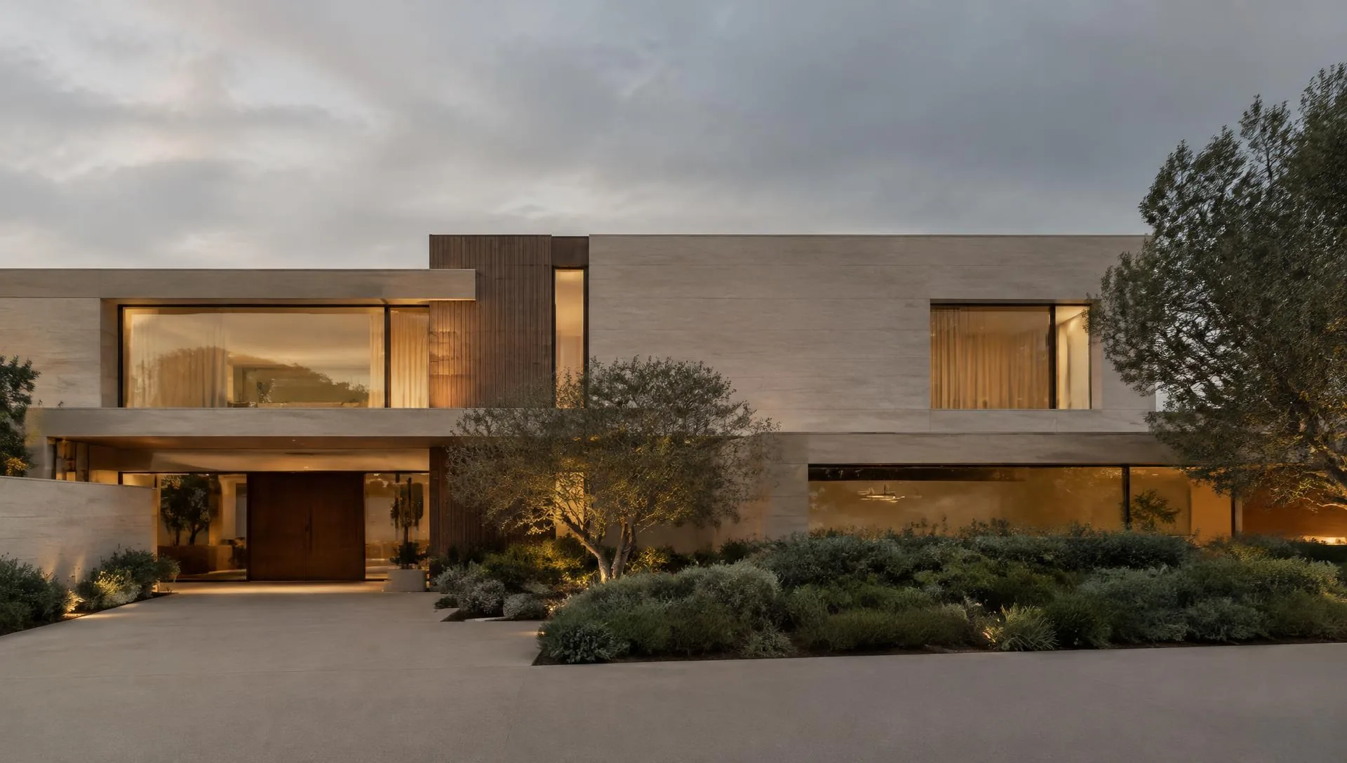 Concept inspiration: Modern limestone and walnut residence at dusk with warm interior light